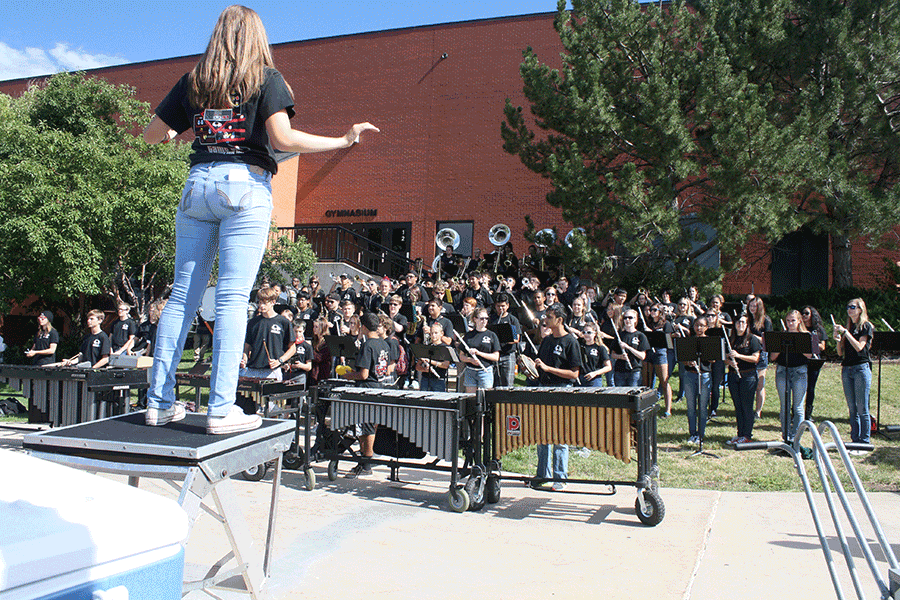 Senior drum major Danielle Lange leads marching band as they perform their first show, gearing up for an entire new season of football games and competition. The group showed off this year’s theme, “Game On,” by sporting their new t-shirts, which feature virtual marching band members. Lange, by earning such a huge title, hopes to lead the band’s growth alongside fellow drum major junior Andres Rodriguez. “I hope that we get better at playing and marching, but I also hope that everybody has fun and it ends up being a very successful year,” she said.