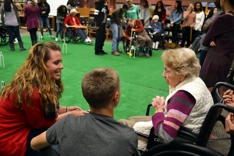 Uniting Generations Bonding over more than just the game, Eaglecrest staff and students interact with elderly dementia patients on Wednesday, as they share stories and smiles. 