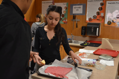 Student prepares patties