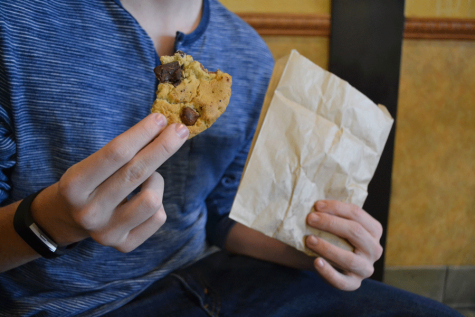 Man holding a Barnes and Noble Cafe cookie