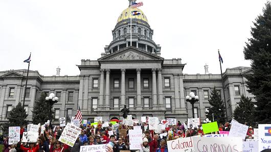 Pictured above is teachers gathering at the capitol
Photo Courtesy of Googleimages 