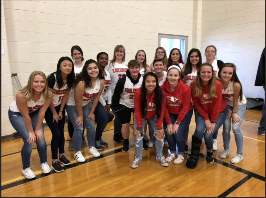 The 2019 Girls Lacrosse team poses in their gear.
