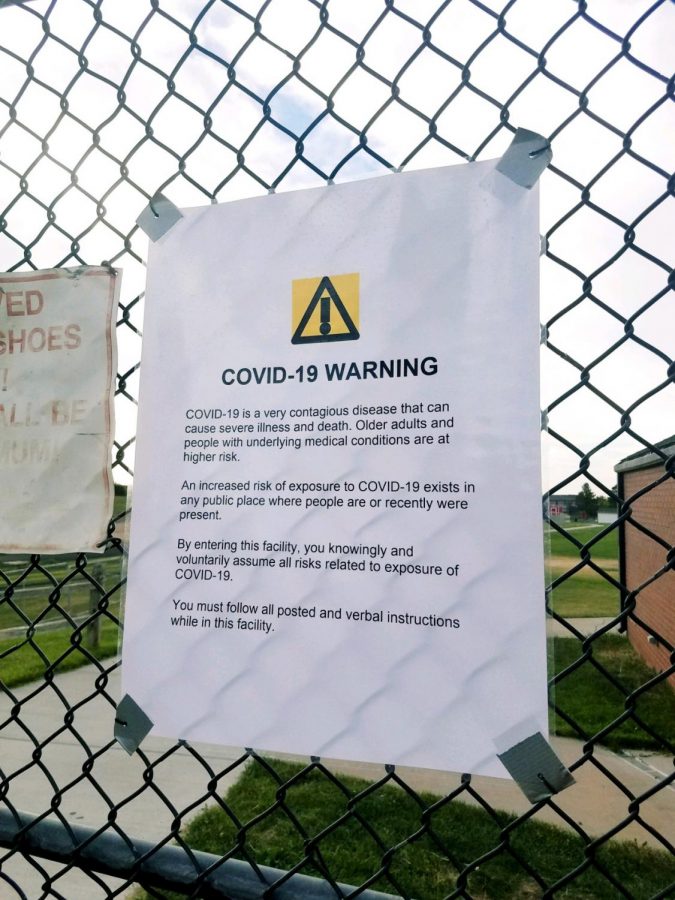 A sign outside Eaglecrest’s track and fields warns of COVID-19 hazards as teams begin to return to workouts.
