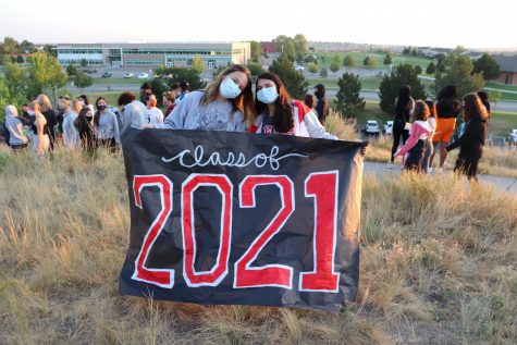 McMillen and Sodhi with a Class of 2021 sign.