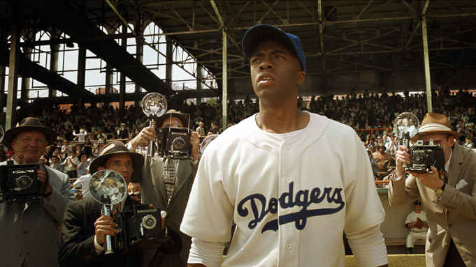 Boseman (middle) as Jackie Robinson surrounded by press in another shot from the movie 42.