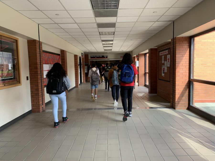 Eaglecrest students walking down the new Covid-19 friendly hallways. 