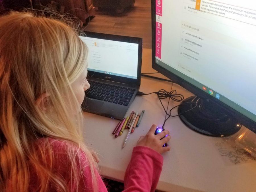 Fourth grader Adelaide Beauchamp works on an online project, engaging in the new, remote form of learning. 