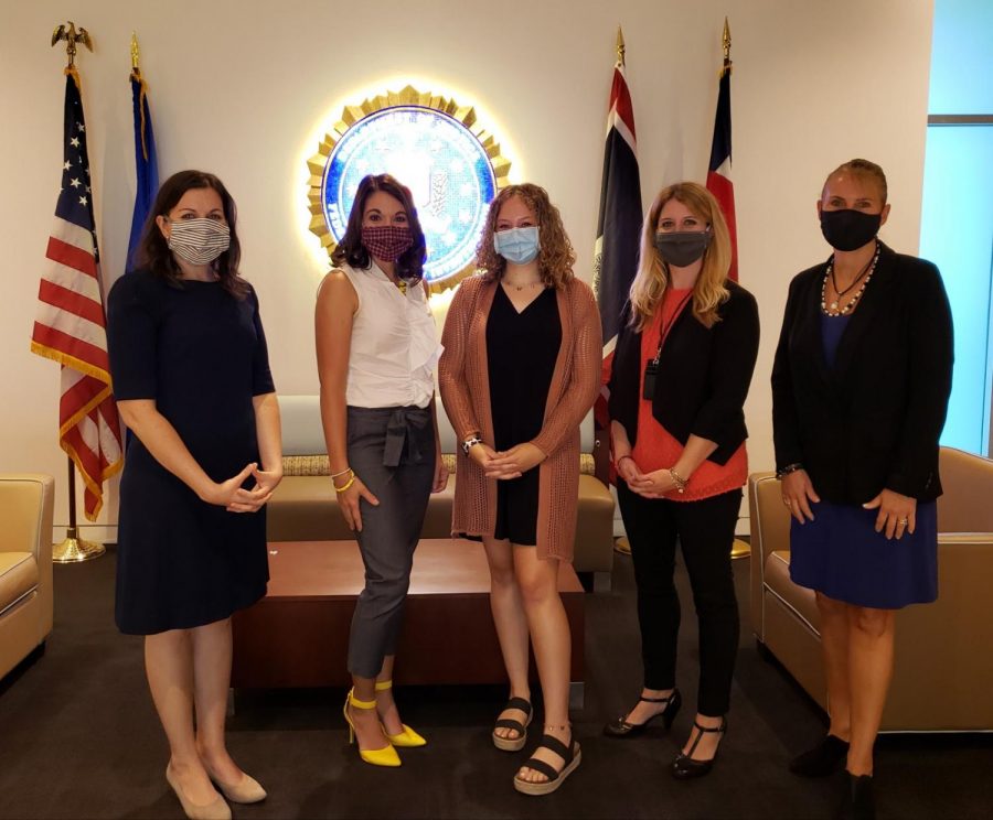 Photo of Kyra Dooley (in the middle) with FBI agents, working together to stop human trafficking (taken by- Leah A. Hapner)