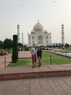 Jewett (right) and her friend standing in front of the Taj Mahal when they were visiting her home country.