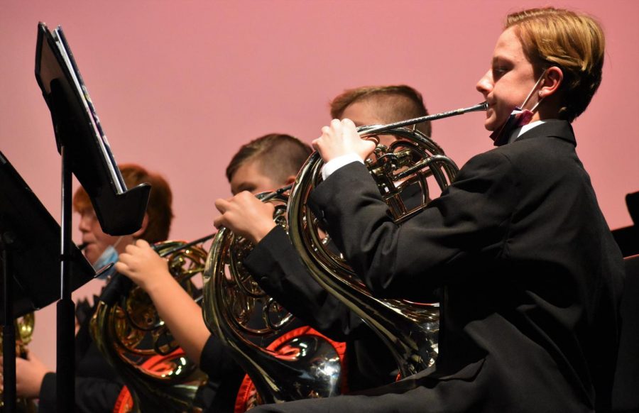 Horn players Declan Suttman, Spencer Wakefield, and Cassidy Bailey play in Symphonic Band, performing 