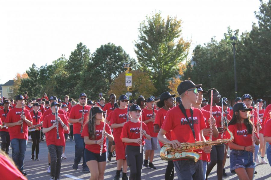 The Eaglecrest Marching Band play as they travel down Picadilly Street along the parade route.