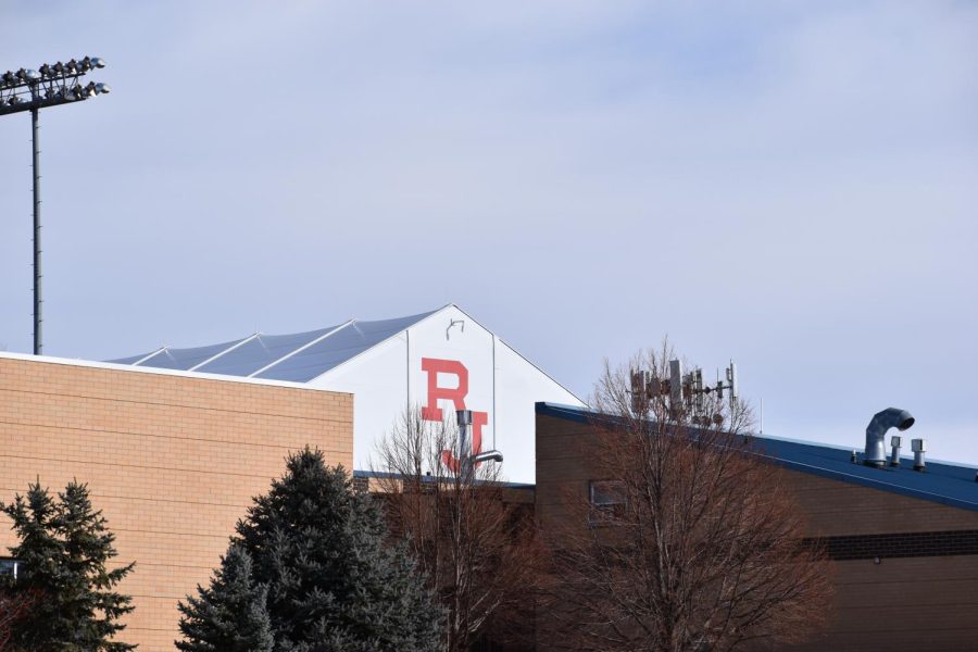 The staple "RJ" is seen on buildings throughout Regis Jesuit High School's expansive campus, also serving as the moniker for their media site: RJ Media. 