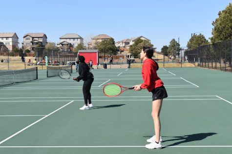 Raeaana Addae (junior) and Isabella Maestas (sophomore.) Get in ready position in their doubles match vs. Grandview.