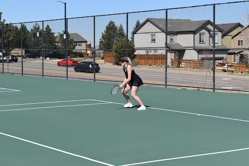 Wilcox warms up her ready position. She is prepared for whatever swing comes her way.