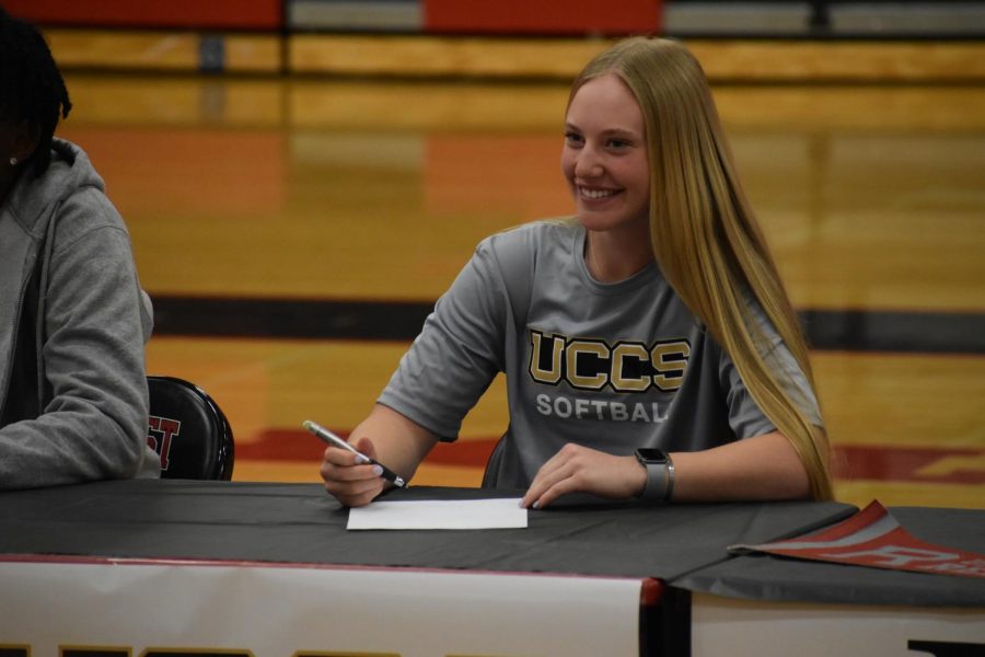 Softball commit Molly Sherwood smiles after officially signing to UCCS.