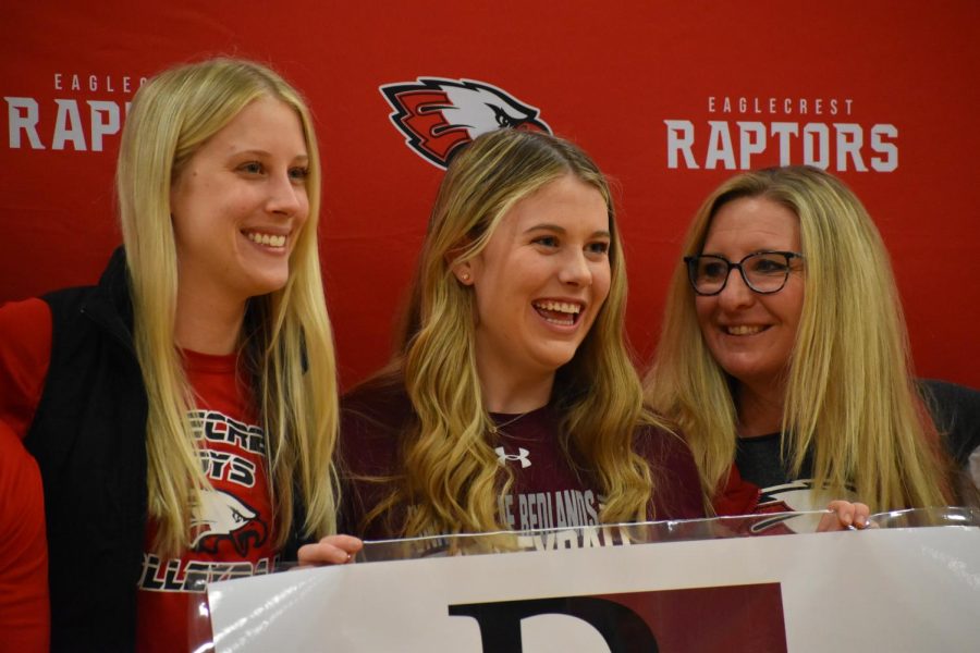 Volleyball coaches pose with their player, University of Redlands commit Kylie Martin.