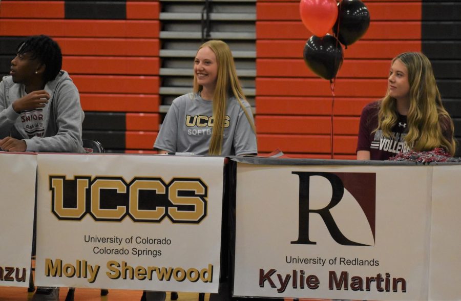 UCCS softball commit Molly Sherwood smiles as her coach speaks to her strength and character on and off the field.