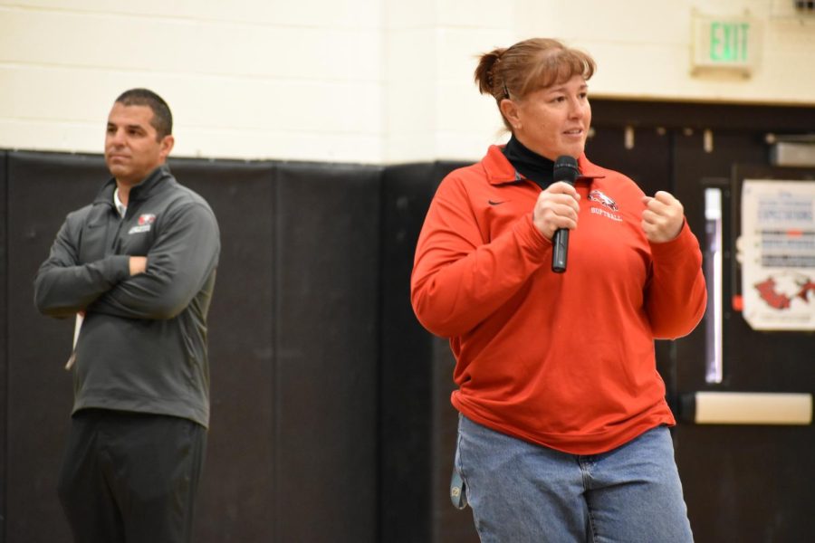 Softball coach Yvette Hendrian speaks her of player and signee Molly Sherwood at the Spring Signing Day, Athletic Director Vincent Orlando in the background.