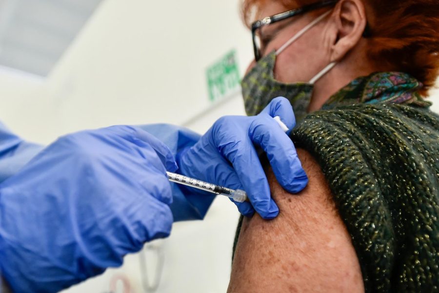 A woman receives a dose of the COVID vaccine in Bergamo, Italy, on March 1, 2021.