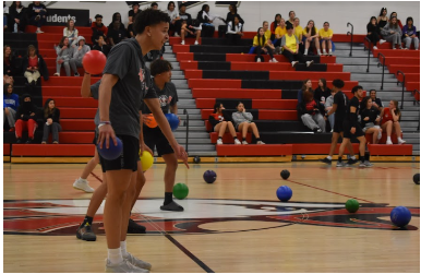 Senior Kayden Johnson (front) and Sophomore Noah Brown (back) Stand in awe as their team takes another win, moving them into the final round. 