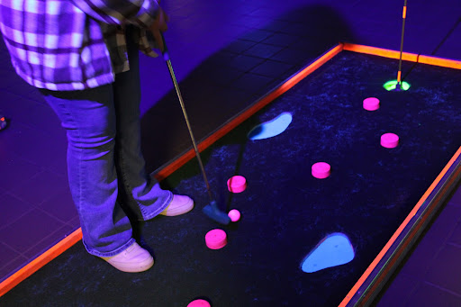 Students playing putt-putt at the Wish Week dance.