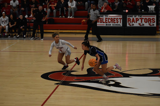 Grandview freshman Lexi Yi is defended by Eaglecrest junior Brooklyn Bickerstaff at half-court in the first quarter.