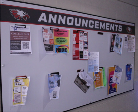 A poster advertising Team R.E.D., surrounded by other attempts to promote Eaglecrest clubs. 