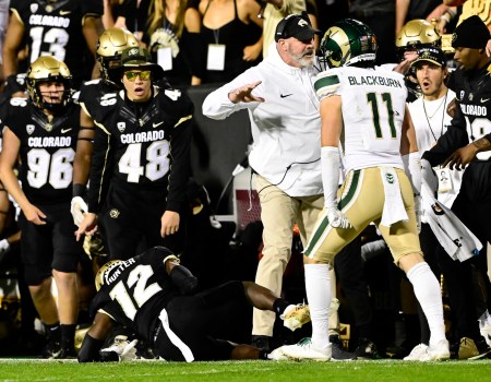 CSU’s Henry Blackburn stands over an injured Travis Hunter after throwing a huge hit along the sidelines in the 2023 Rocky Mountain Showdown.