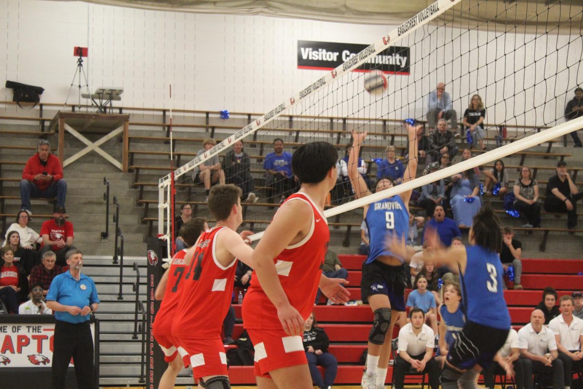 Some members of the EHS Varsity Boys Volleyball prepare to block a spike that Grandview High School prepares to hit over to them.