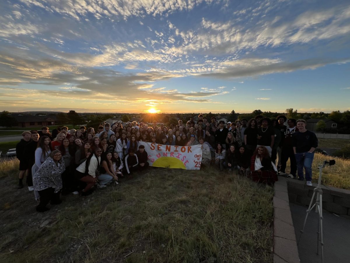 Seniors group together for a photo at the end of Senior Sunrise.