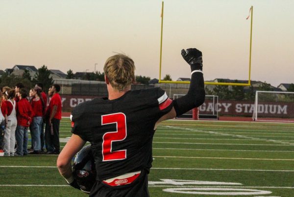 Senior WR Burke Withycombe honoring his team as they're about to go out for the opening kick off.