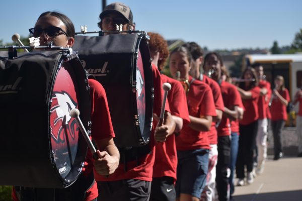 The band preparing to go walk through one of the schools.