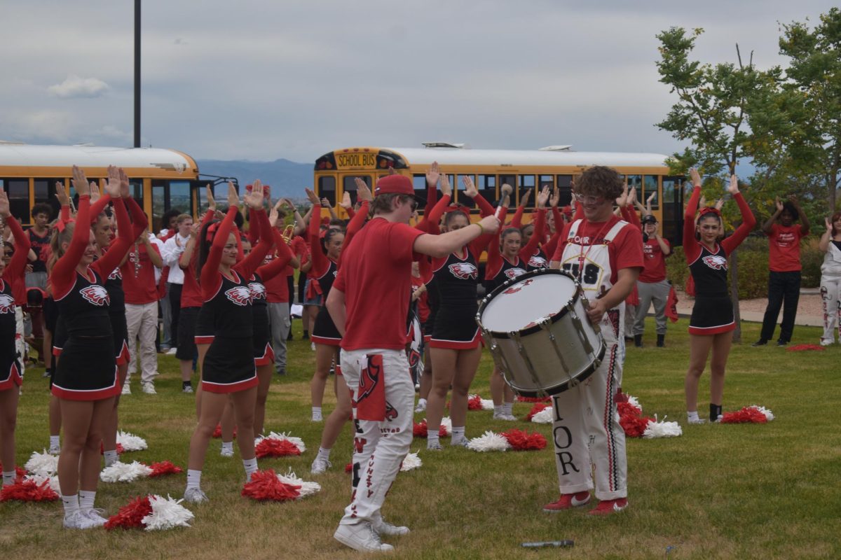 Jack Randels (12) hitting the drum for one of the Eaglecrest cheers. 