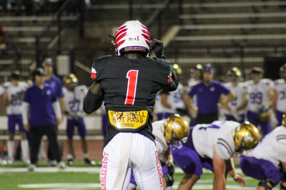 Senior DB Elvin Ampofo strapping up his helmet getting ready to lock down the other teams WR.