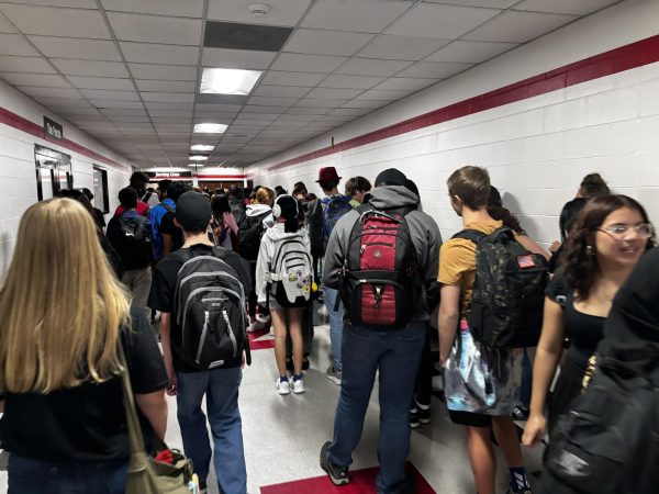 Students wait in the crowded line to get their food during First Lunch