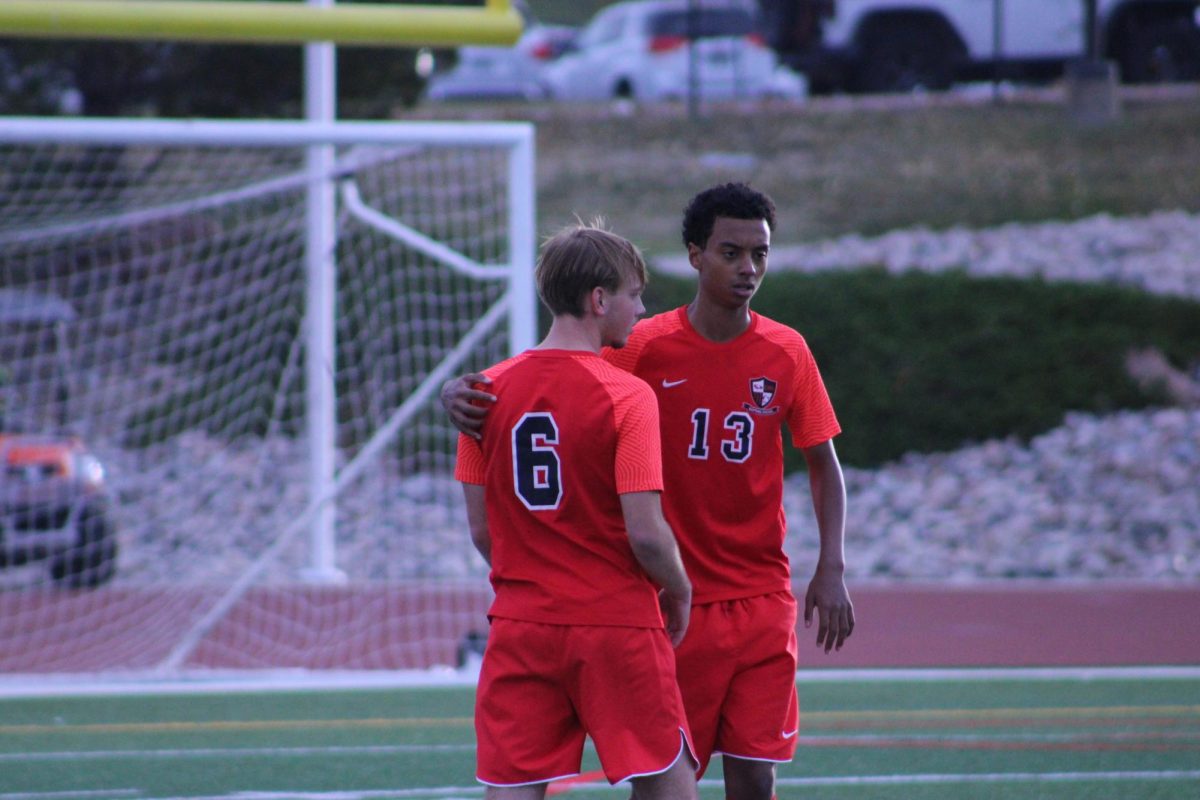 Junior Adam Keresemo reassuring senior Ethan Robl during the match.