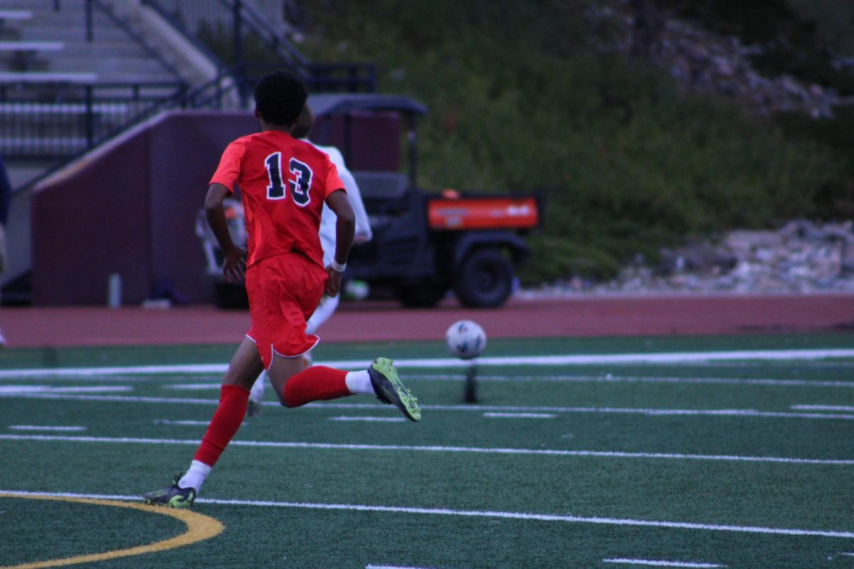 Junior Adam Keresemo chasing after a Mullen player. 