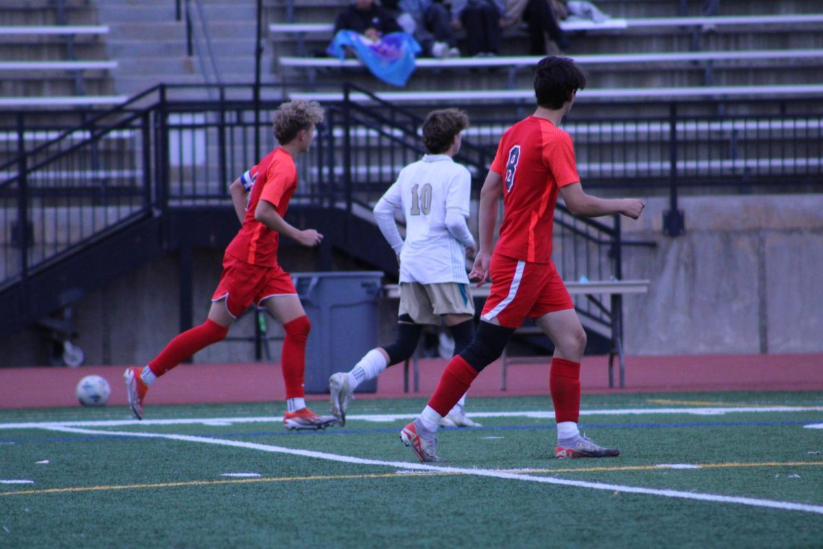 Junior Drew Tullio and senior Isaac Olezewski running down the field together.