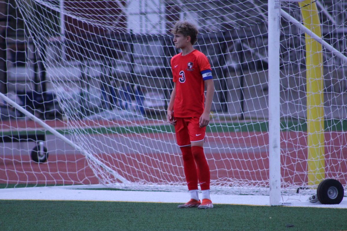 Junior Drew Tullio standing in front of goal, waiting for the ball.