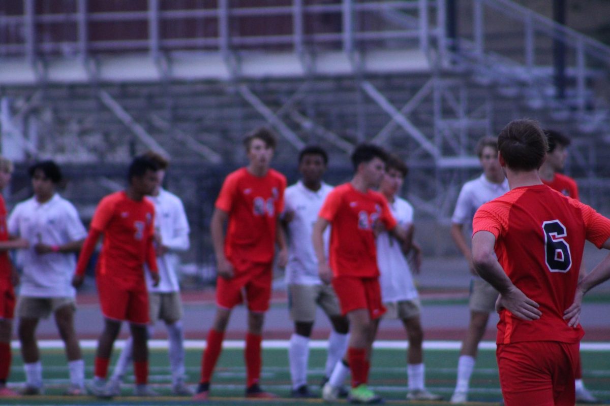 Focused on senior Ethan Robl, with his team in the background.