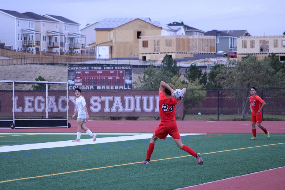 Senior Gus Zillman throwing the ball inbounds.