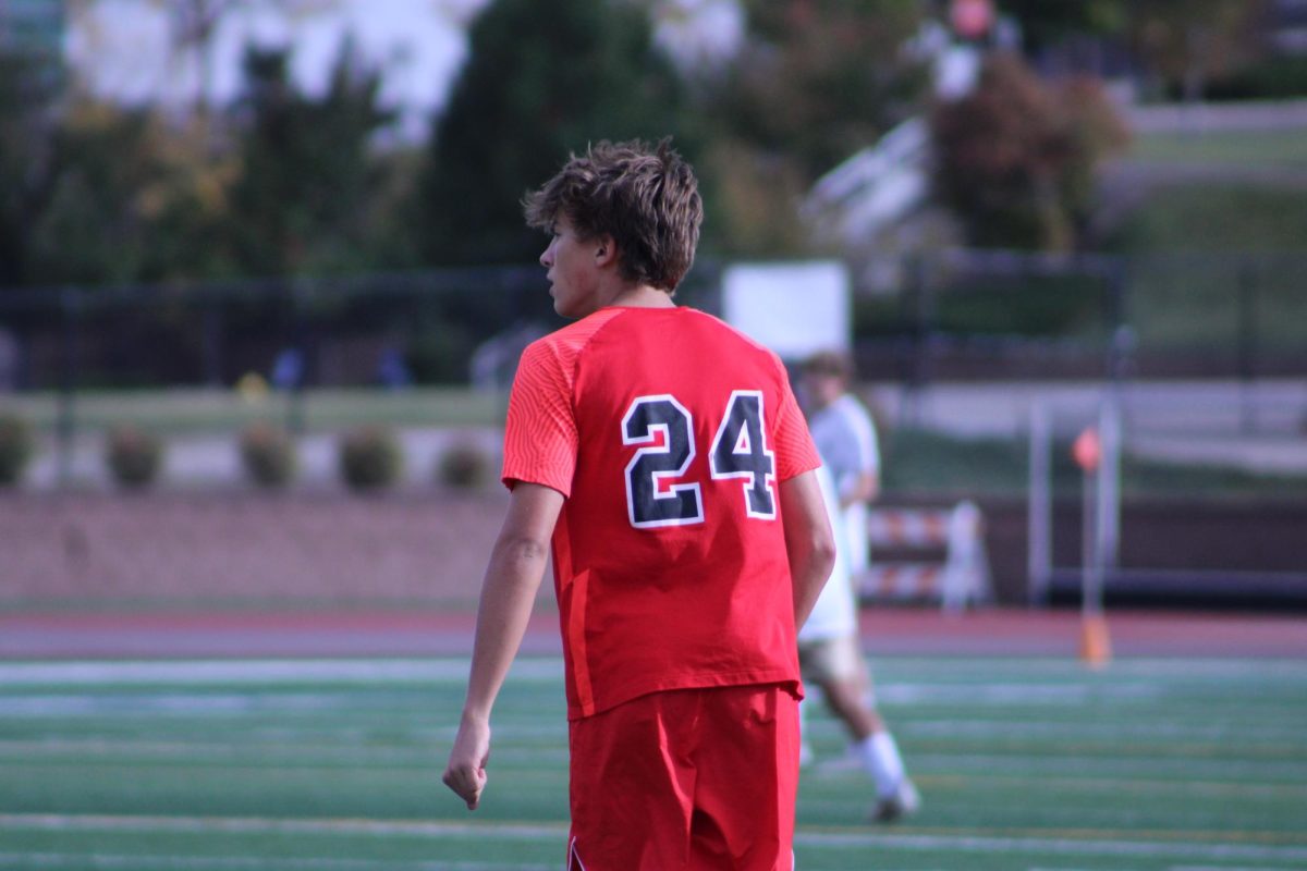 Senior Gus Zillman watching his teammate dribble the ball down the field.