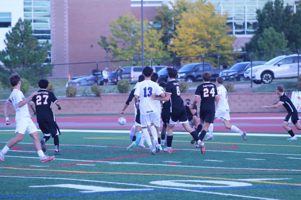Members of the EHS boys varsity soccer team fend off Grandview players from their goal.
