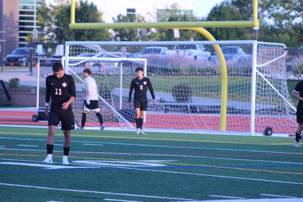 Senior Vazgen Ghazaryan walks across the field to meet up with his team mates.