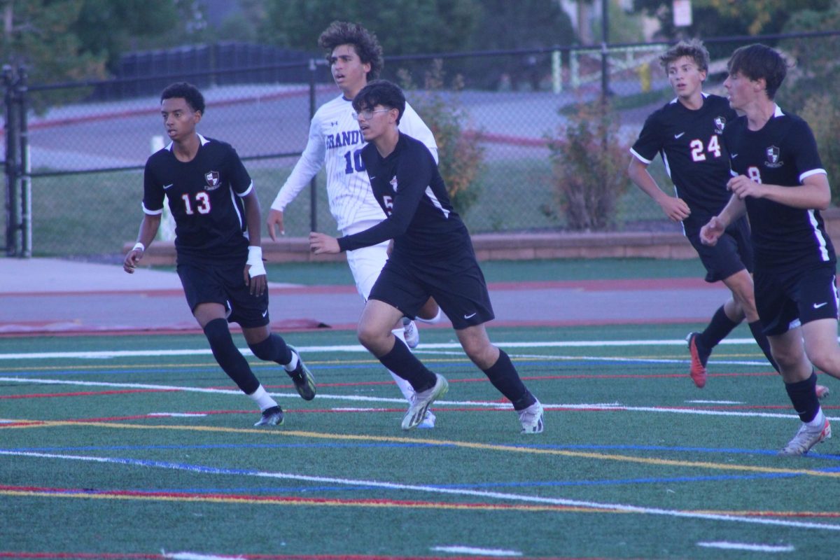 Senior Gus Zilliman, senior Issac  Olszewski, senior Kyler Mayta, and junior Adam Keresemo focus on getting the ball back from the opposing team.