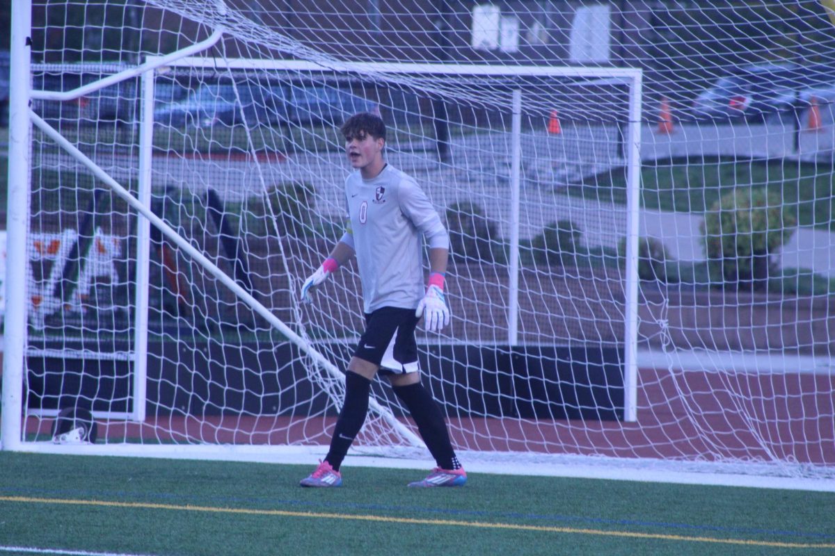 Senior Blair Nelson talks to his teammates across the field in an attempt to support them as best he could.