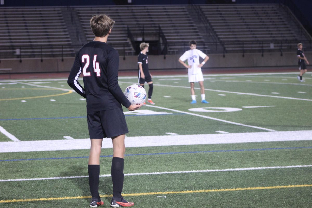 Senior Gus Zilliman gets ready to make a throw in.  He is working as hard as he can to help his team seal a win.