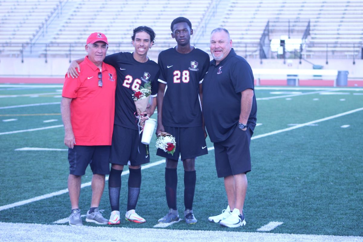 Seniors Reda Sabbahi and Mohamed Sylla enjoy their senior night with both of their coaches.