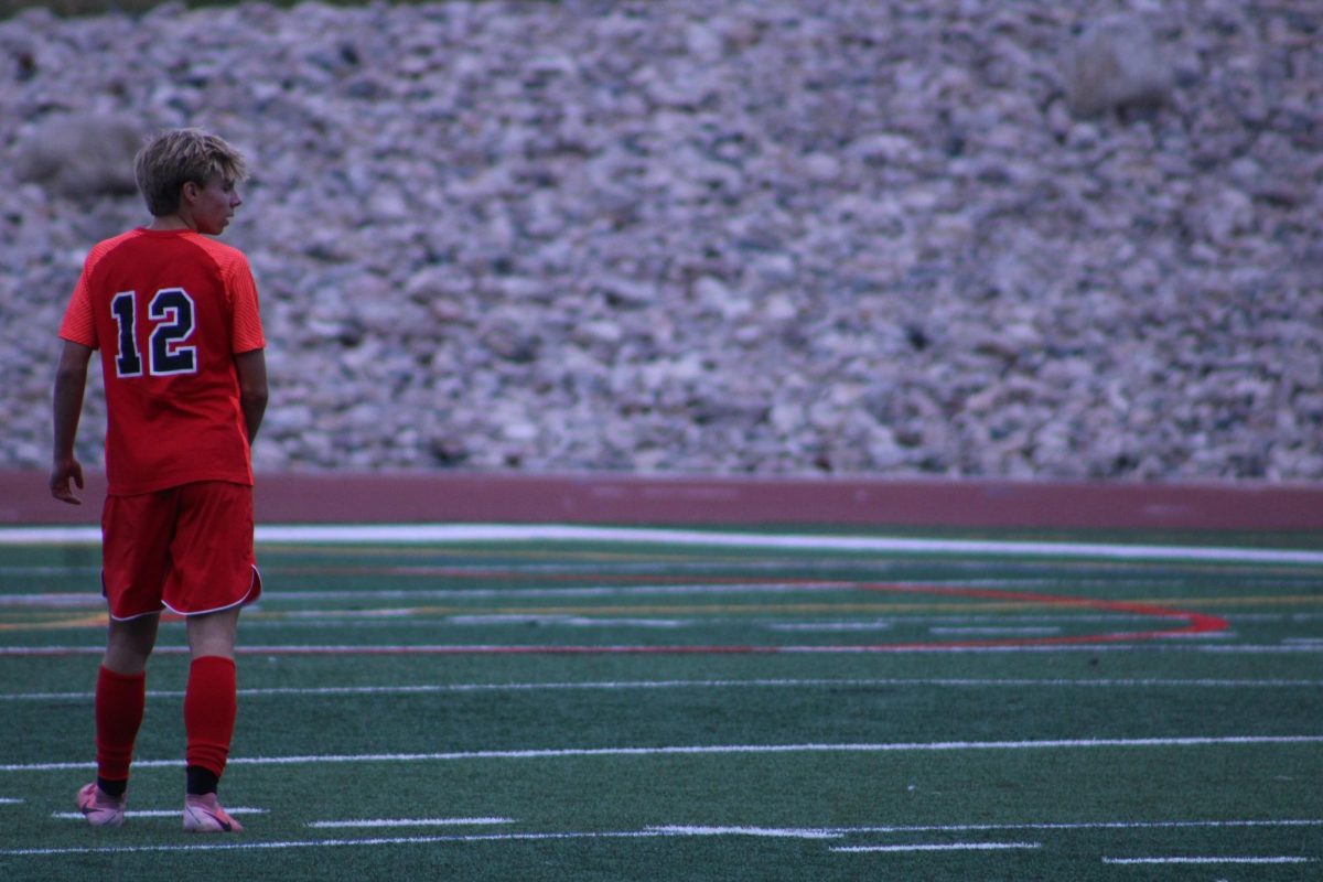 A wide shot of sophomore Keegan Wiezorek waiting for his team mates to move up the field.