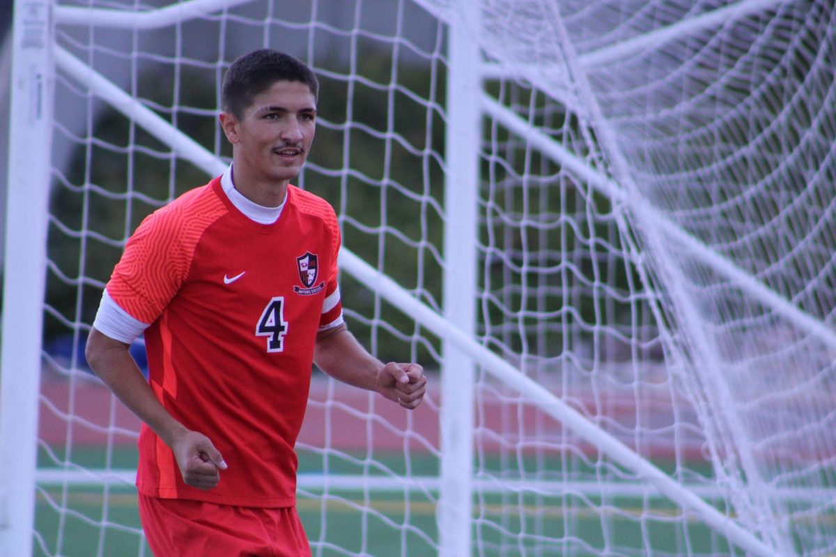 A close up of senior Roman Yoder protecting the goal.